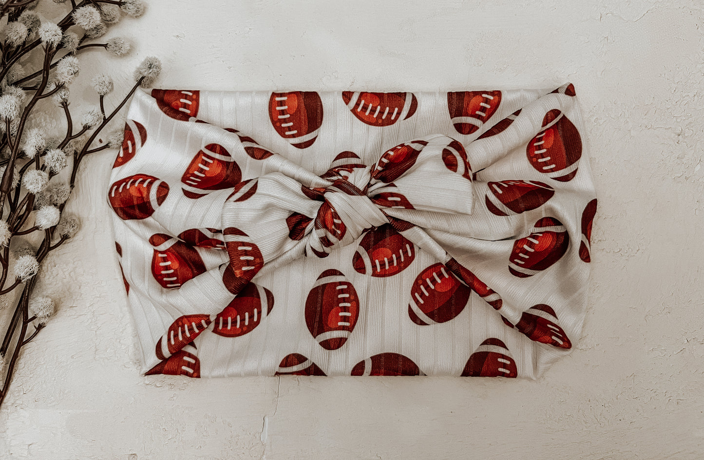 Ribbed football faux bow