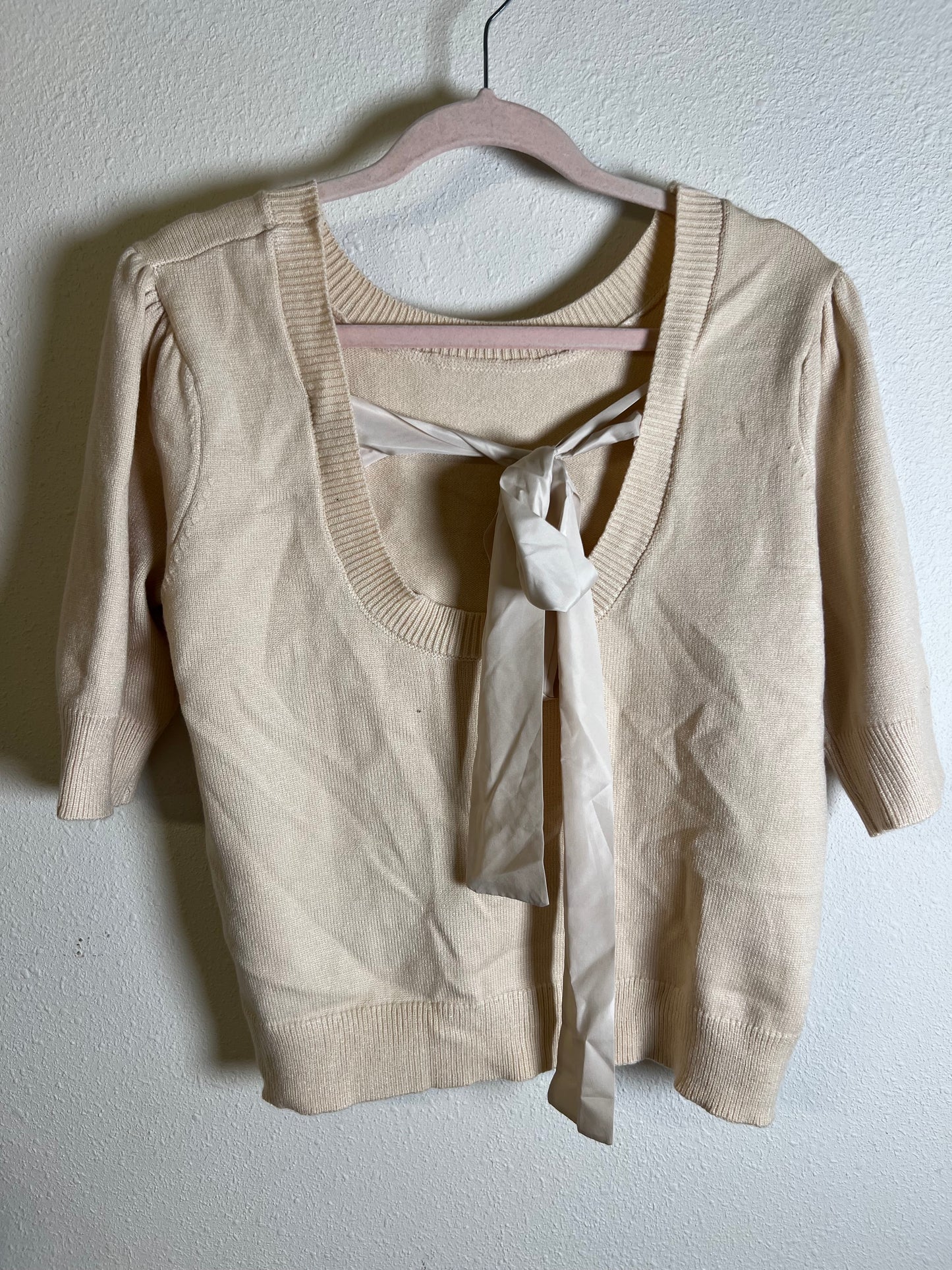 Large tan bow sweater