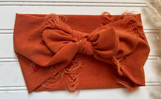 Distressed orange faux bow